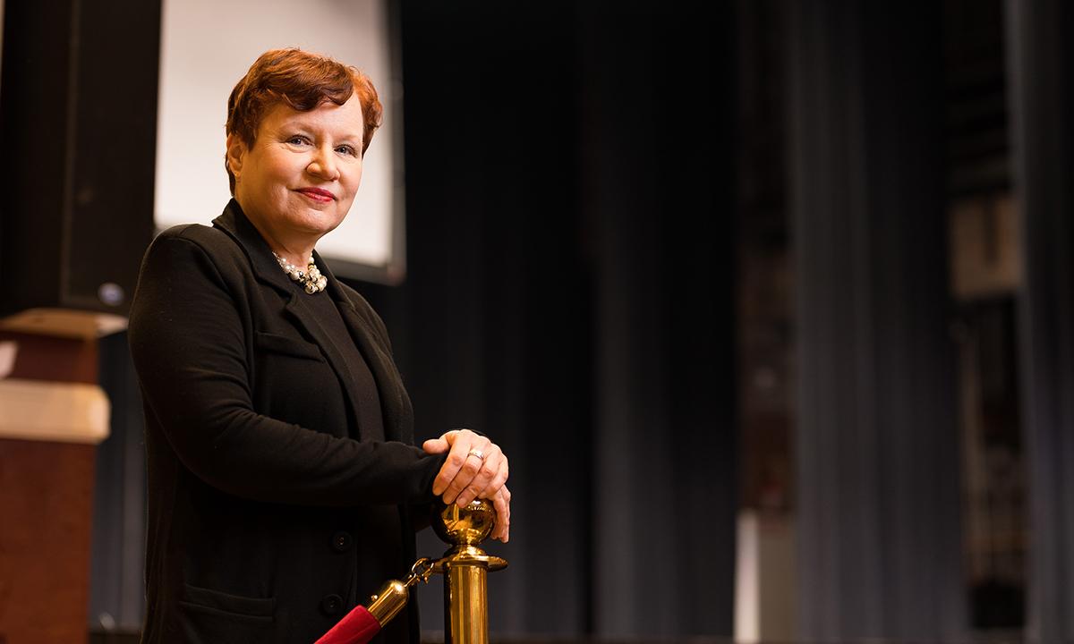 A woman standing in a theatre